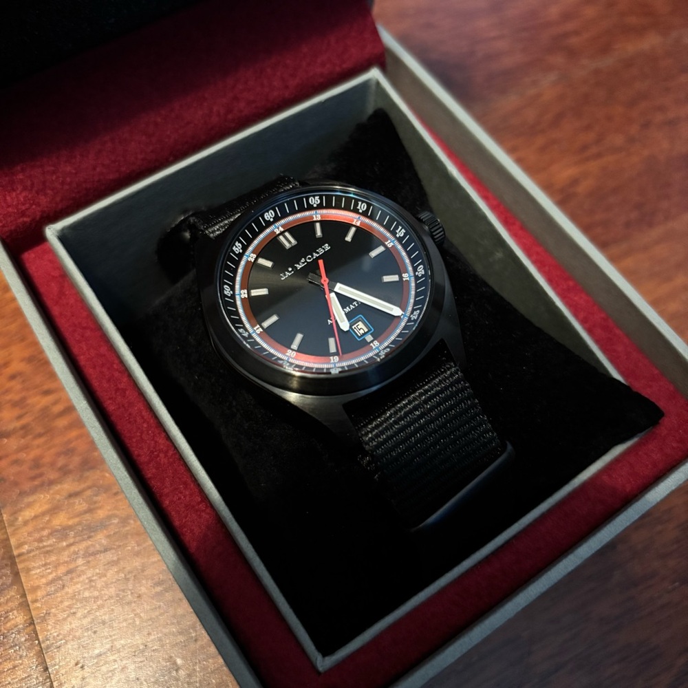 James McCade automatic sport watch with red accents